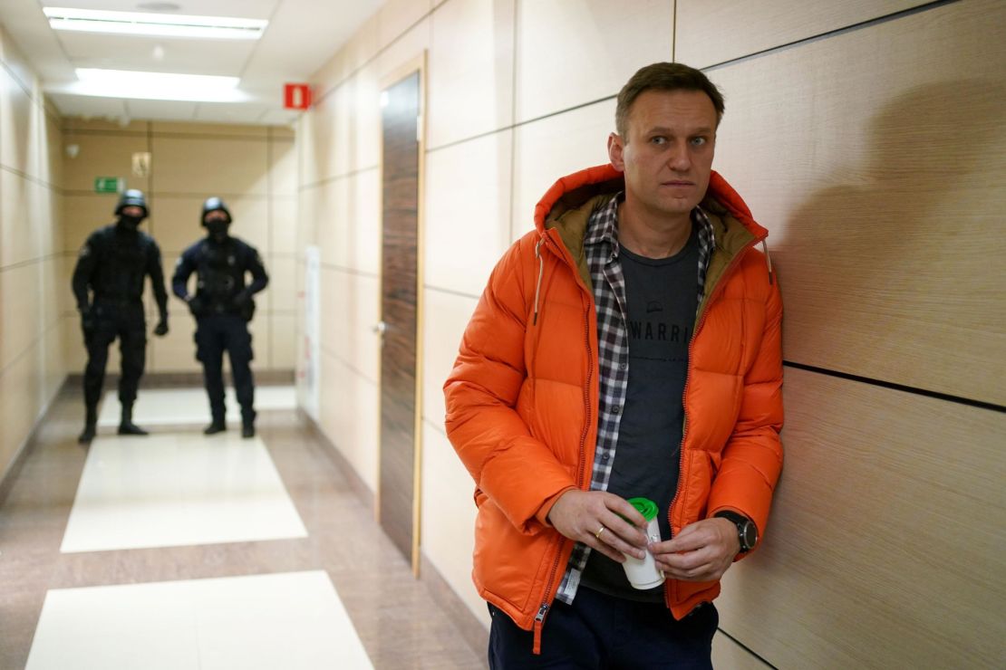 Russian opposition leader Alexey Navalny, photographed near law enforcement officers at his Anti-Corruption Foundation in Moscow last year, is always under surveillance.