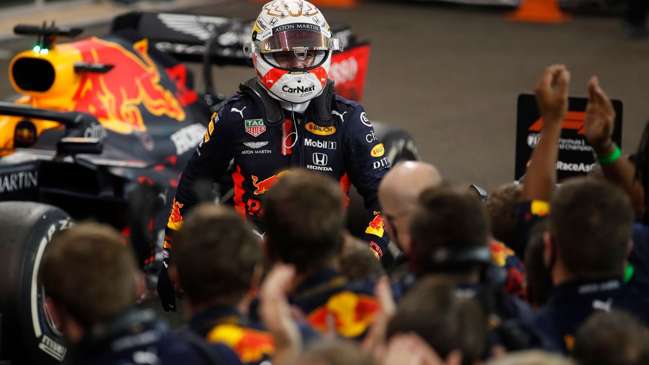 Red Bull's Max Verstappen celebrates with the team after winning the Abu Dhabi GP.