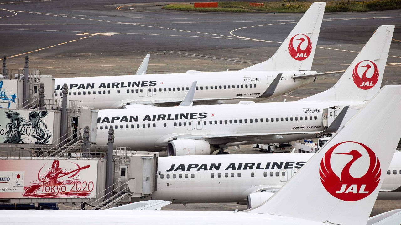 Passenger jets of Japan Airlines (JAL) are seen on the tarmac at Tokyo's Haneda airport on October 30, 2020. (Photo by Behrouz MEHRI / AFP) (Photo by BEHROUZ MEHRI/AFP via Getty Images)
