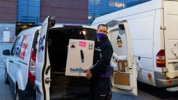A FedEx driver delivers a box containing the Pfizer-BioNTech COVID-19 vaccine to Rhode Island Hospital in Providence, R.I., Monday, Dec. 14, 2020. (AP Photo/David Goldman)