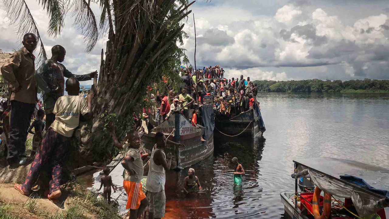 A passenger boat stops for a break on the shores of Ingende. These boats can take weeks to make their way down-river to Kinshasa.