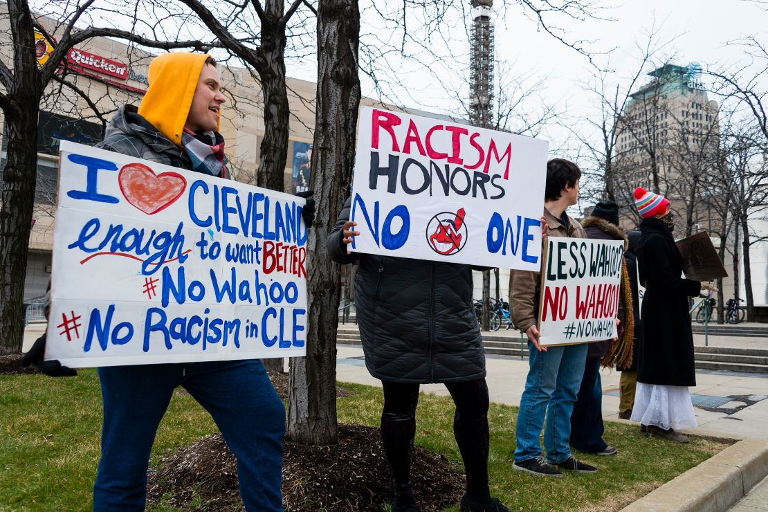 Protesters express their disapproval of the Cleveland Indians Chief Wahoo logo before the game against the Kansas City Royals outside Progressive Field on April 6, 2018, in Cleveland.