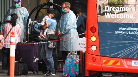 Travellers arrive at a hotel in Melbourne on December 7, 2020 where Australians returning from overseas will quarantine as part of precautions against the Covid-19 coronavirus. - An outbreak of the coronavirus from hotel quarantine earlier in the year from saw a second wave of infections and a suspension of arrivals until today. (Photo by William WEST / AFP) (Photo by WILLIAM WEST/AFP via Getty Images)