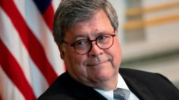 WASHINGTON, DC - AUGUST 04: Attorney General William Barr listens during an event to highlight the Department of Justice grants to combat human trafficking, in the Indian Treaty Room of the Eisenhower Executive Office Building on August 4, 2020 in Washington, DC. The Trump administration is issuing more than $35 million in grants to provide safe housing to survivors of human trafficking. (Photo by Drew Angerer/Getty Images)