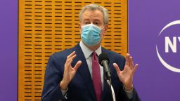 Mayor Bill de Blasio delivers remarks ahead of the first COVID-19 vaccinations at NYU-Langone Hospital on Monday, Dec. 14, 2020, in New York. Hundreds of thousands of health care workers across the country are expected to receive the vaccine this week. (AP Photo/Kevin Hagen).