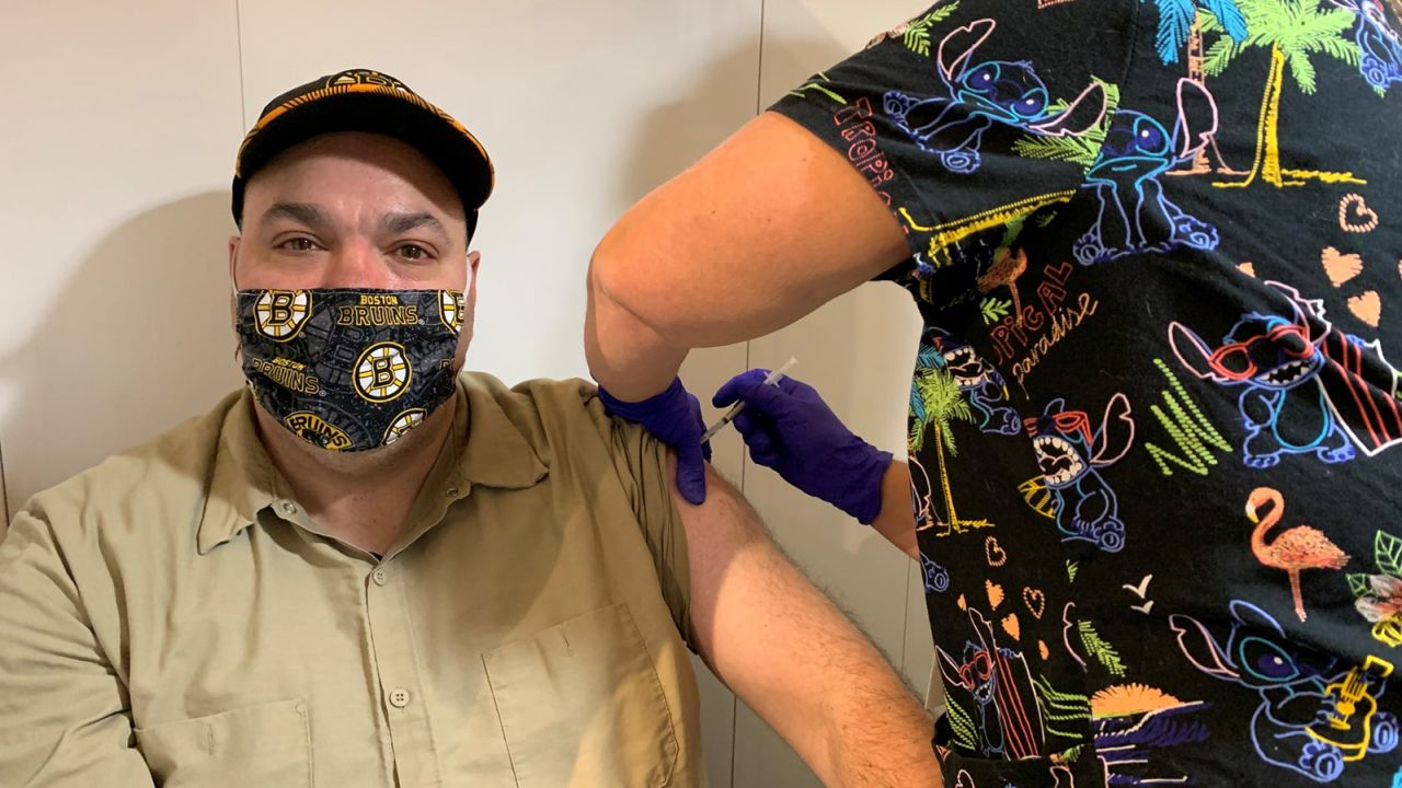 Andrew Miller, a housekeeper in the Environmental Management Service at the VA Bedford Healthcare System, was the first employee to receive the Covid-19 vaccine on Monday.