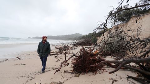 BYRON BAY, AUSTRALIA - DECEMBER 14:  Local resident Nick Colby checks the damage due to erosion along the beach side, December 14, 2020 in Byron Bay, Australia. Byron Bay's beaches face further erosion as wild weather and hazardous swells lash the northern NSW coastlines. (Photo by Regi Varghese/Getty Images)