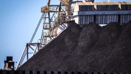 A bucket-wheel reclaimer stands next to a pile of coal at the Port of Newcastle in Newcastle, New South Wales, Australia, on Monday, Oct. 12, 2020. Prime Minister Scott Morrison warned last month that if power generators don't commit to building 1,000 megawatts of gas-fired generation capacity by April to replace a coal plant set to close in 2023, the pro fossil-fuel government would do so itself. Photographer: David Gray/Bloomberg via Getty Images