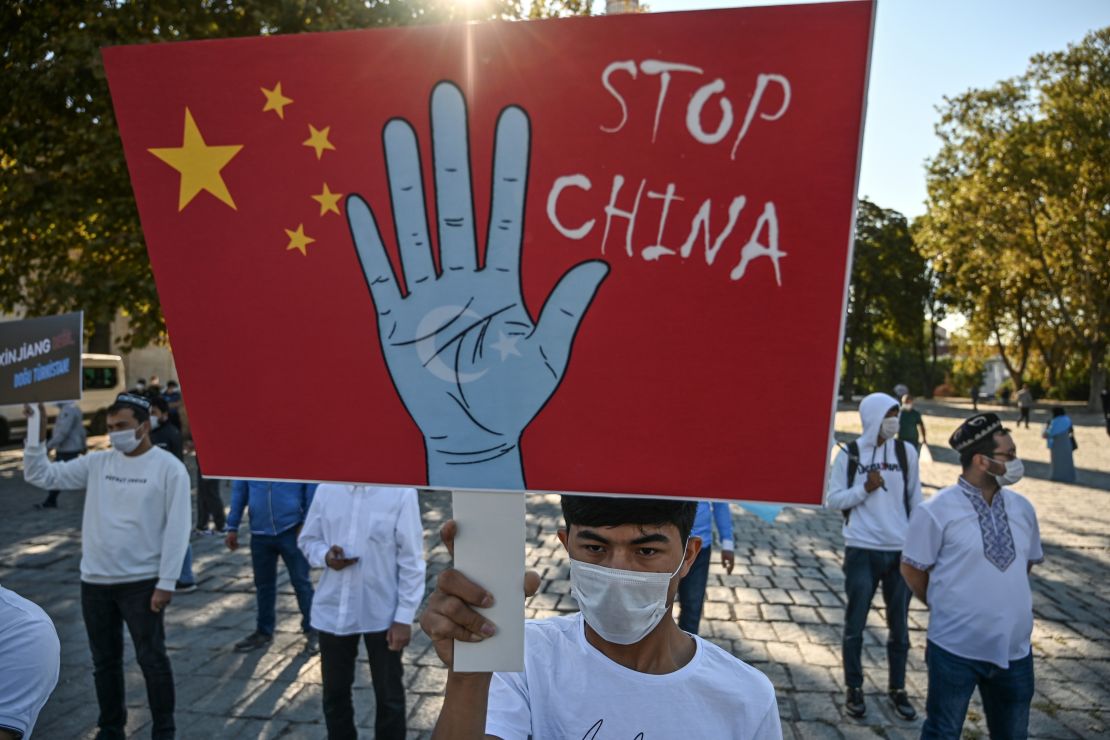 Supporters of China's Uyghur minority hold placards as they gather at the Beyazit Square on October 1, 2020 during a demonstration in Istanbul, Turkey.