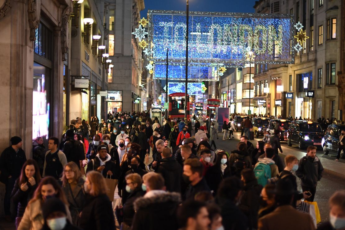 Christmas illuminations are seen above shoppers on London's Regent Street on December 15.
