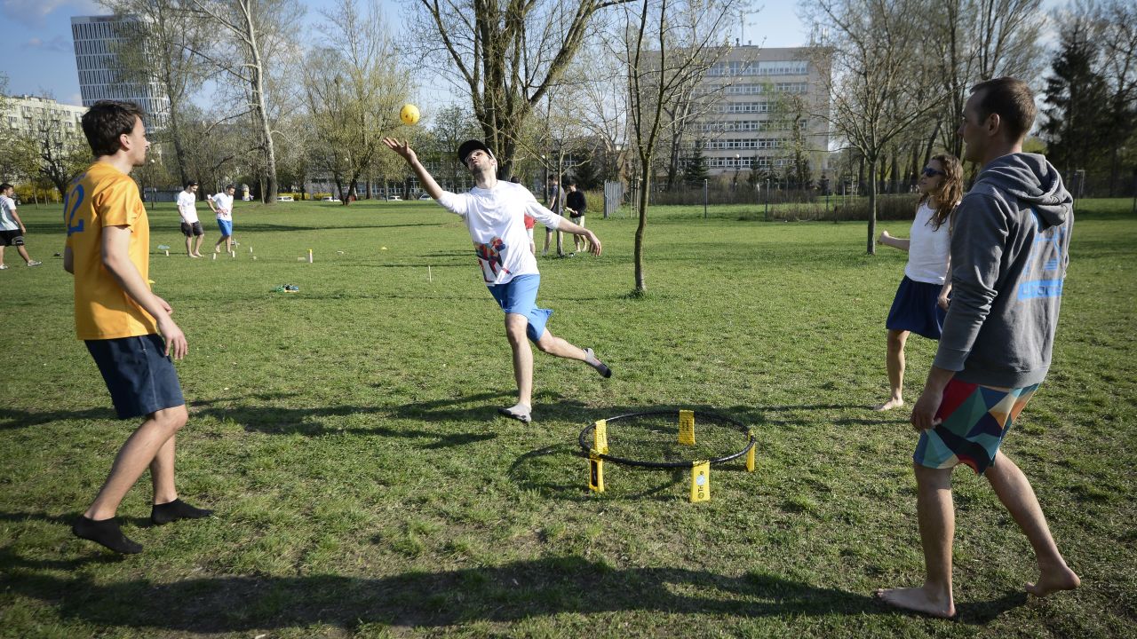 People play spikeball in Mokotów Field in Warsaw, Poland, on April 14, 2018.
