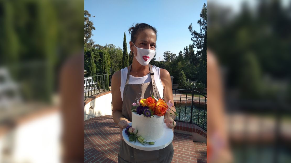 Elaine Ardizzone, owner of Sweet Cheeks Baking Company in San Diego, delivering a small wedding cake.