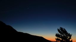 Saturn, top, and Jupiter, below, are seen after sunset from Shenandoah National Park, Sunday, Dec. 13, 2020, in Luray, Virginia. 