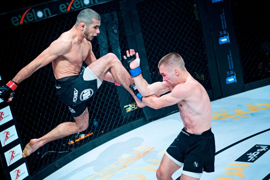 Mokaev (left) aims a knee at Jamie Kelly during Brave CF 43 in Bahrain.