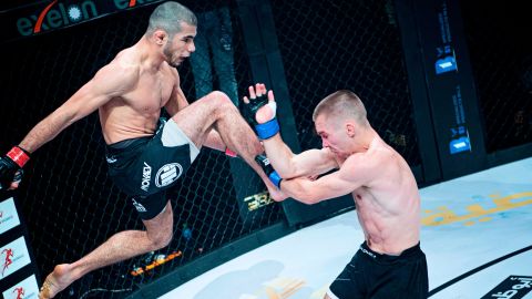 Mokaev (left) aims a knee at Jamie Kelly during Brave CF 43 in Bahrain.