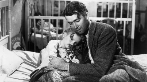 Actor Jimmy Stewart as George Bailey, hugs his daughter, in a still from director Frank Capra's classic film, 'It's a Wonderful Life.'