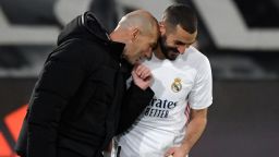 TOPSHOT - Real Madrid's French forward Karim Benzema (R) celebrates with Real Madrid's French coach Zinedine Zidane after scoring a goal during the Spanish league football match between Real Madrid CF and Athletic Club Bilbao at the Alfredo di Stefano stadium in Madrid on December 15, 2020. (Photo by OSCAR DEL POZO / AFP) (Photo by OSCAR DEL POZO/AFP via Getty Images)