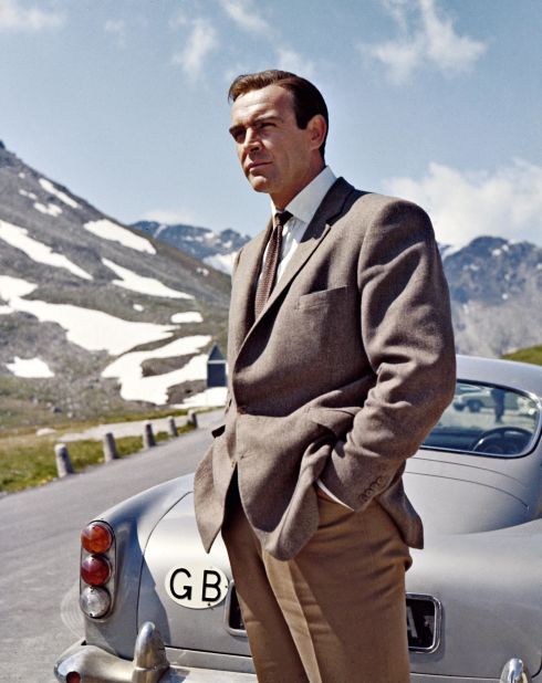 The late Sean Connery pictured alongside Bond's Aston Martin DB5. Scroll through the gallery to see more images from behind the scenes of the "Goldfinger" Alpine sequence.