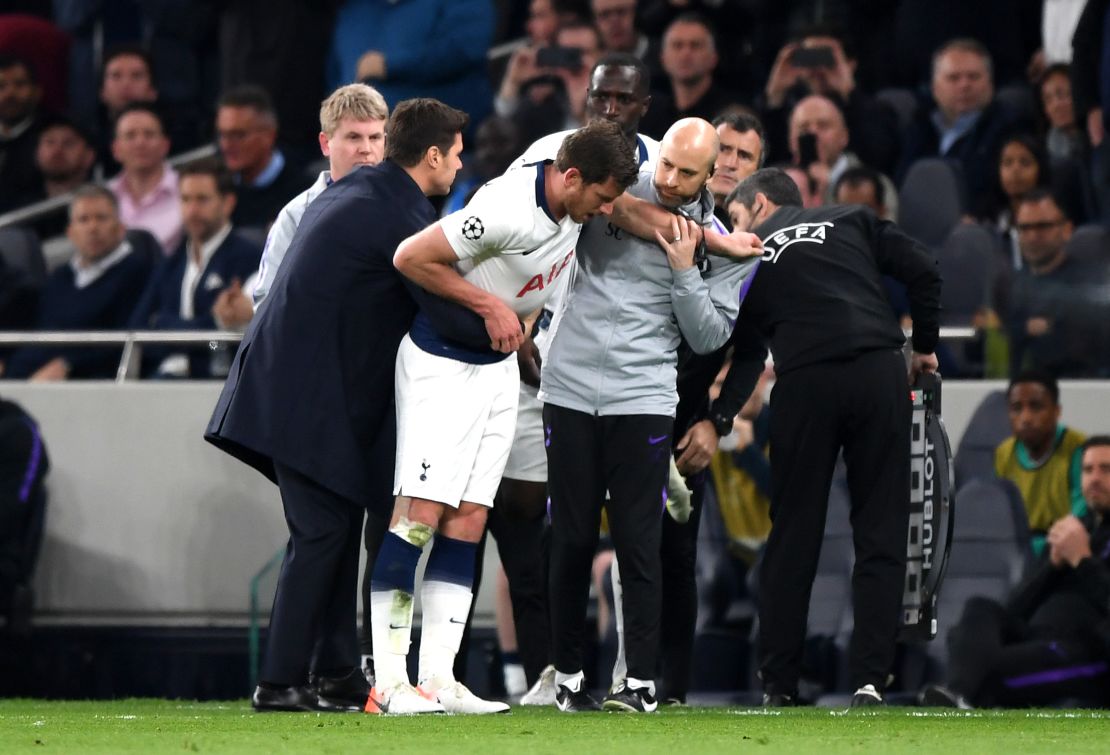Vertonghen is helped from the field during Tottenham's Champions League game against Ajax in 2019.