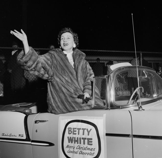 White rides in a Christmas parade in Los Angeles in 1955. 