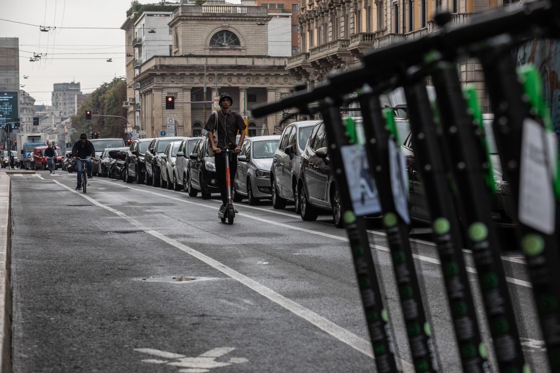 A man rides an electric scooter on a pop-up bike lane on Corso Buenos Aires, in Milan, on September 23, 2020.