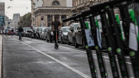 A man rides an electric scooter on a pop-up bike lane on Corso Buenos Aires, in Milan, on September 23, 2020.