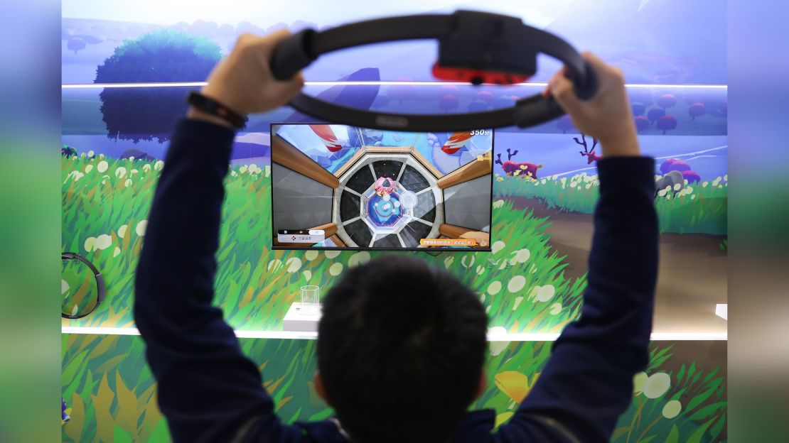 A visitor plays the Ring Fit Adventure game at the Nintendo booth during the Third China International Import Expo November 6 in Shanghai. 