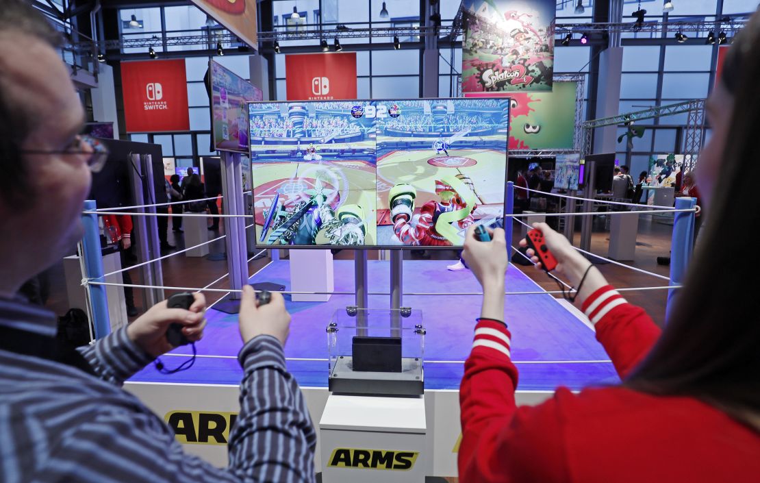 Visitors play Arms on the Nintendo Switch console during its German premiere in Offenbach, Germany, January 13, 2017.