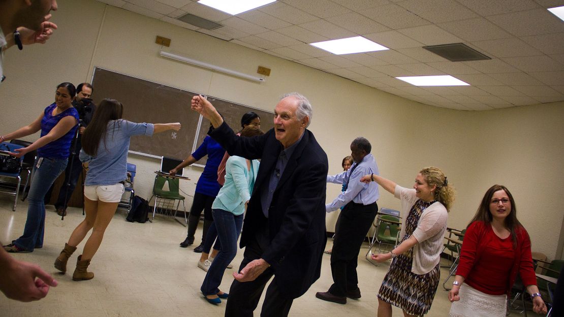 Alda works with students on an improv exercise.