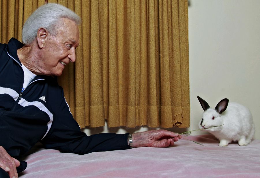 Barker plays with his pet Mr. Rabbit at his home in Los Angeles in 2011.
