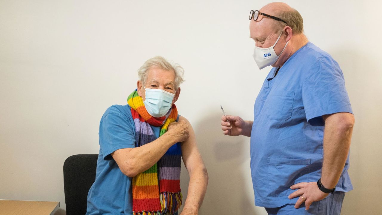 Ian McKellen talks to Dr Phil Bennett-Richards as he receives his first dose of the Covid-19 vaccine.