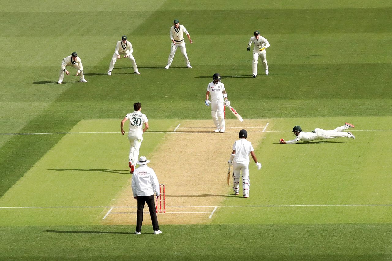 Australian cricketer Matthew Wade dives for a catch during a Test match against India on Thursday, December 17.