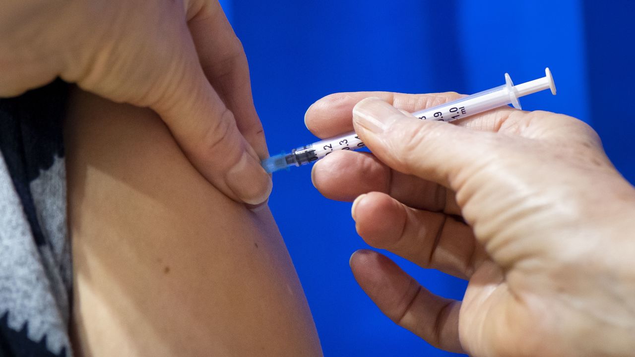 CARDIFF, WALES - DECEMBER 08: A close-up of a syringe containing a Pfizer-BioNTech Covid-19 vaccine as it is given to a patient at Cardiff and Vale Therapy Centre on December 8, 2020 in Cardiff, Wales. Wales joined the other UK nations in rolling out the covid-19 vaccine on Tuesday, a rare moment of coordination after months of disjointedness in the four nations' pandemic response. Wales introduced a 17-day "firebreak" lockdown in October and November to suppress the surge in covid-19 cases, but infections have continued to rise.  (Photo by Matthew Horwood/Getty Images)