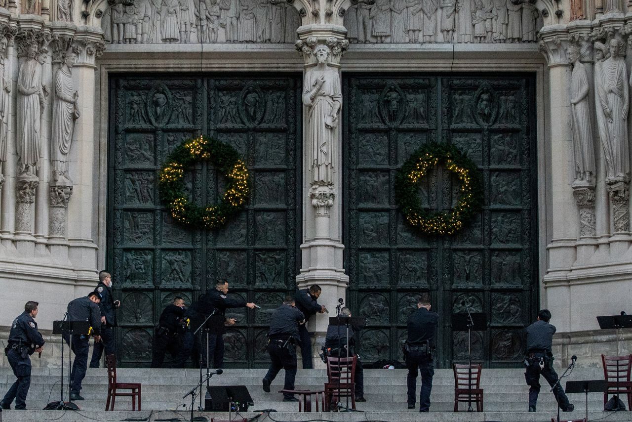 Police officers surround a gunman <a href="https://www.cnn.com/2020/12/13/us/nyc-church-shooting-chirstmas-concert-trnd/index.html" target="_blank">who opened fire on the steps of a New York City cathedral</a> on Sunday, December 13. The gunman — a man in his 50s — was shot by responding police officers, authorities said, and he was later pronounced dead at a hospital. Nobody was hit by the gunman's fire.