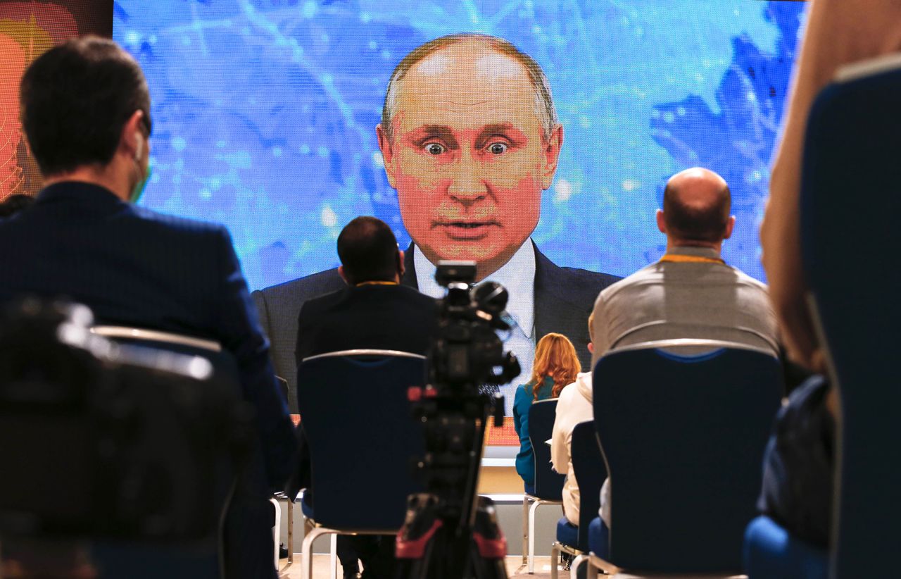 Russian President Vladimir Putin is seen on a video screen in Moscow as he holds <a href="https://www.cnn.com/2020/12/17/europe/putin-annual-press-conference-intl/index.html" target="_blank">his annual news conference</a> on Thursday, December 17. Putin attended this year's conference via video.