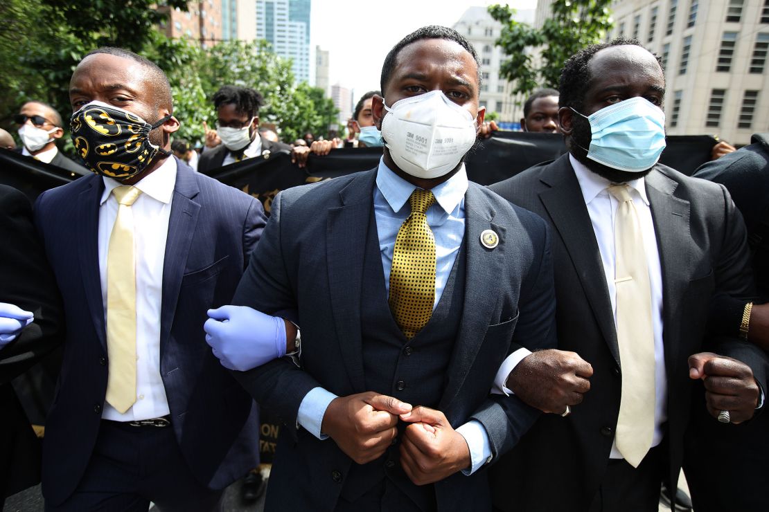 Members of Alpha Phi Alpha Fraternity march in New York after a memorial service for George Floyd this past summer.
The fraternity is among among the groups leading campaigns to educate Black people about the vaccine.