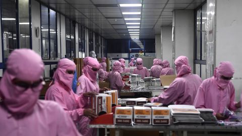 Workers pack syringes at the Hindustan Syringes factory, India's biggest syringe manufacturer, is ramping up production to churn out a billion units, anticipating a surge in demand.