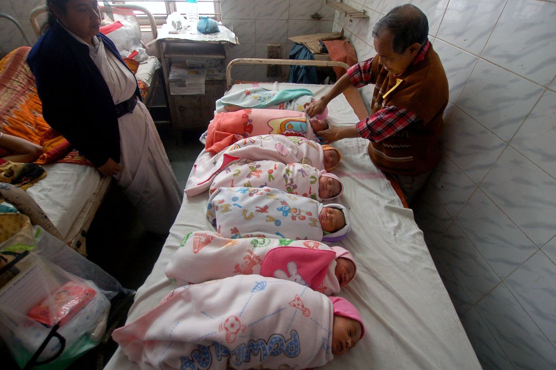 An Indian health official administers polio vaccination drops to newborn babies at a hospital in Agartala, India's northeastern state of Tripura.
