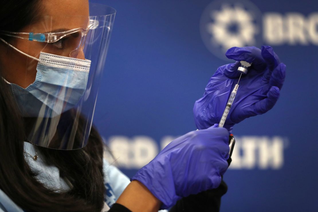 Nurse practitioner Kristina Castro prepares a Pfizer-BioNtech vaccine on December 17, 2020, in Fort Lauderdale, Florida.