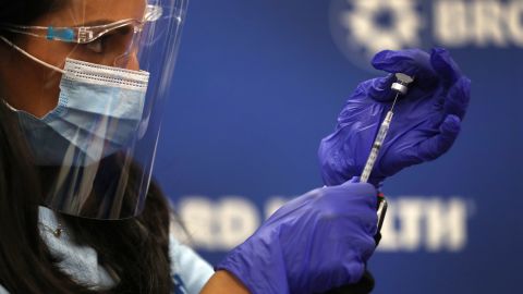 Nurse practitioner Kristina Castro prepares a Pfizer-BioNtech vaccine on December 17, 2020, in Fort Lauderdale, Florida.