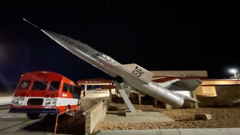 An F-104 Starfighter plane is mounted near the entrance of Test Pilot School at Edwards Air Force Base in California.
