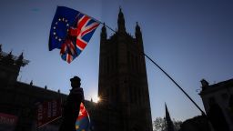 FILE: Anti-Brexit campaigners wave a European Union flag and a Union Jack, also known as a Union Flag, during a protest near the Houses of Parliament in London, U.K., on Wednesday, Feb. 27, 2019. European Union and Jack flags as Brexit trade talks that were on the verge of a breakthrough descended into a fight between the U.K. and France on Thursday as the British government said prospects of an imminent deal had receded. Photographer: Simon Dawson/Bloomberg via Getty Images