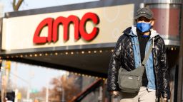 A person wears a face mask outside AMC 84th Street 6 movie theater on the Upper West Side as the city continues the re-opening efforts following restrictions imposed to slow the spread of coronavirus on December 11, 2020 in New York City. The pandemic has caused long-term repercussions throughout the tourism and entertainment industries, including temporary and permanent closures of historic and iconic venues, costing the city and businesses billions in revenue. (Photo by Noam Galai/Getty Images)
