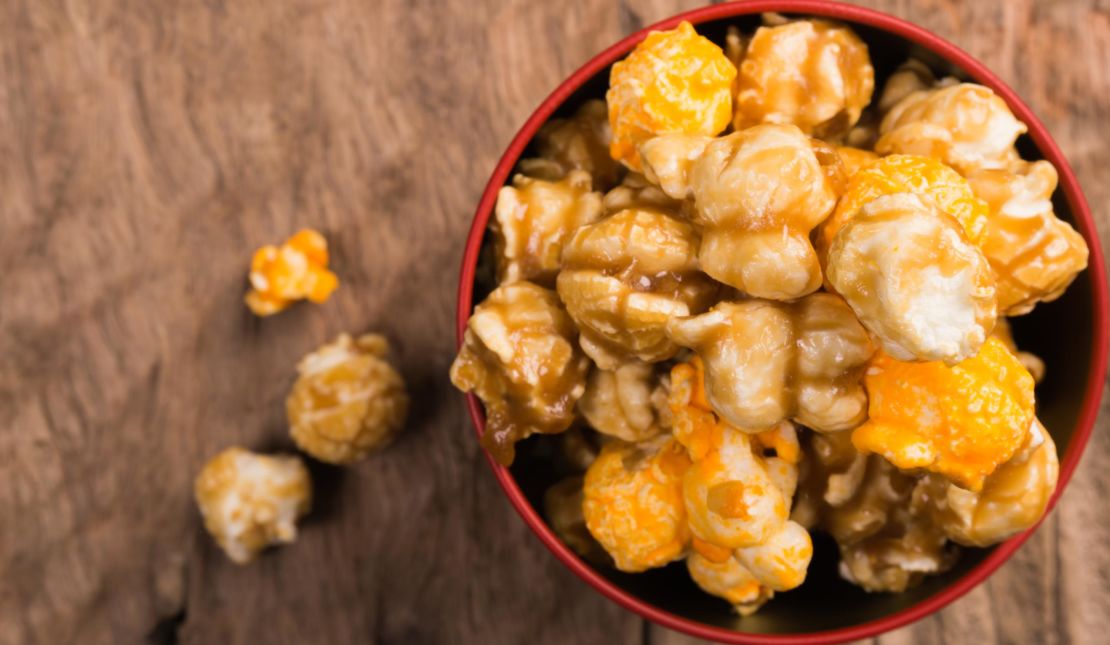 Christmas movie watching is incomplete without hot caramel popcorn for snacking.