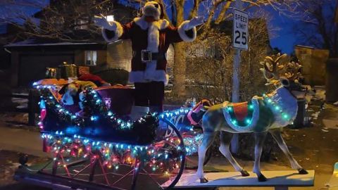 Carmody as Santa Claus on his sleigh.