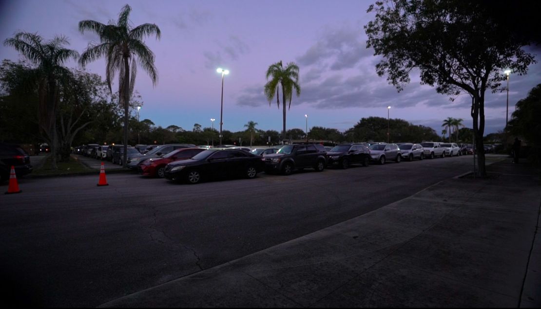 Drivers lined up before dawn on December 19, 2020, for free food in Boynton Beach, Florida. 