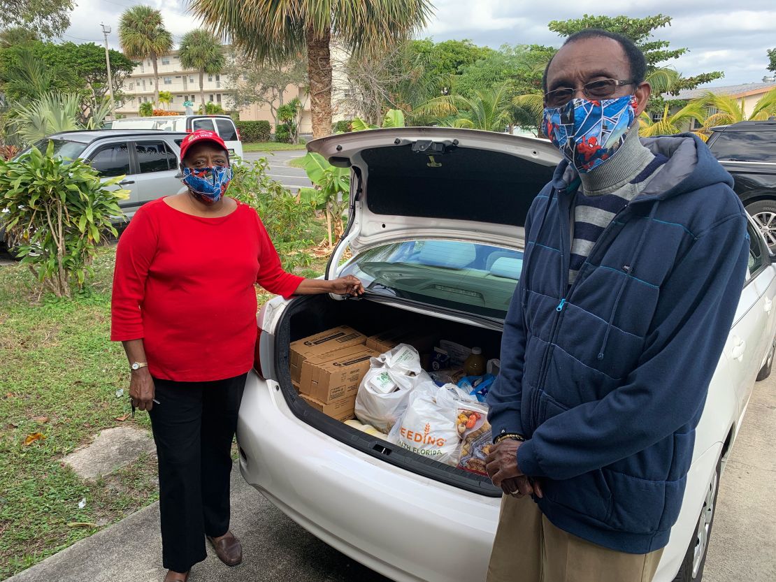 Julie and Leonard Thompson woke up at 3:45 a.m. to get in line for free food at a Boynton Beach, Florida, mall. They say they will deliver the  items to friends and neighbors.