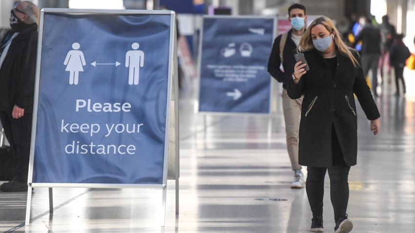 LONDON, ENGLAND - DECEMBER 20: Commuters are seen wearing face coverings at Waterloo train station on December 20, 2020 in London, England. London and large parts of southern England were moved into a newly created "Tier 4" lockdown, closing non-essential shops and limiting household mixing. The government also scrapped a plan to allow multi-household "bubbles" to form for over a 5-day period around Christmas. (Photo by Peter Summers/Getty Images)