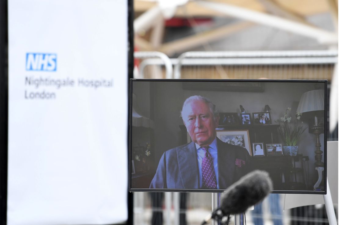 Prince Charles is seen on a monitor as he speaks during the opening of the "NHS Nightingale" field hospital, at the ExCeL London exhibition center, in London on April 3.