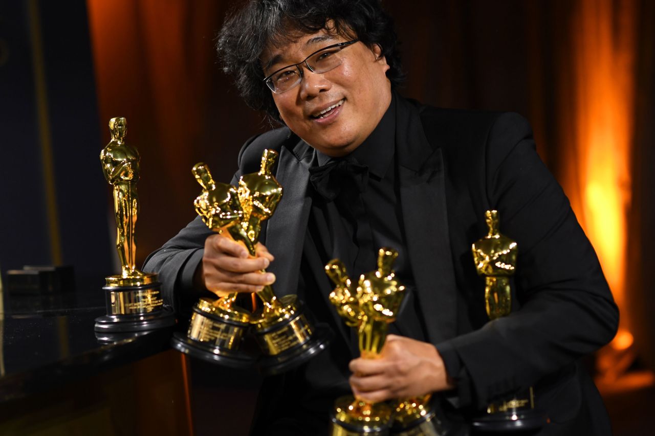 Bong Joon-ho poses with his engraved awards on February 9, 2020.